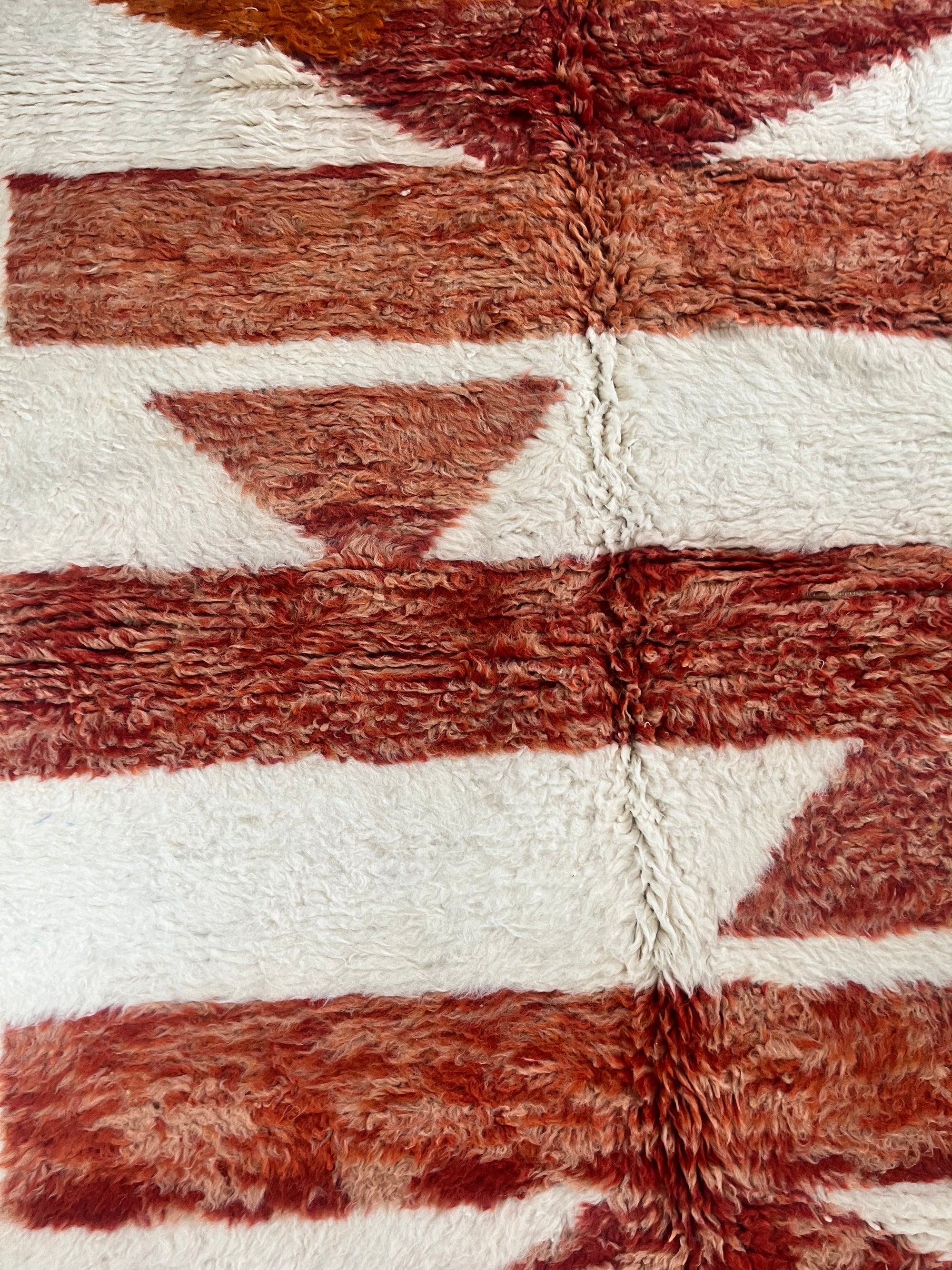 Nehal 5 x 8 Handwoven Beni Ourain Rug in Cream and Dark Orange.