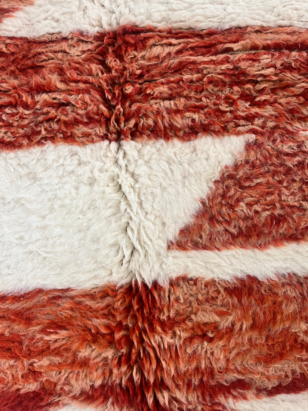 Nehal 5 x 8 Handwoven Beni Ourain Rug in Cream and Dark Orange.