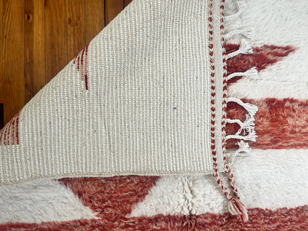 Nehal 5 x 8 Handwoven Beni Ourain Rug in Cream and Dark Orange.