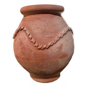 Side view of small Moroccan terracotta planter showing hand-carved details